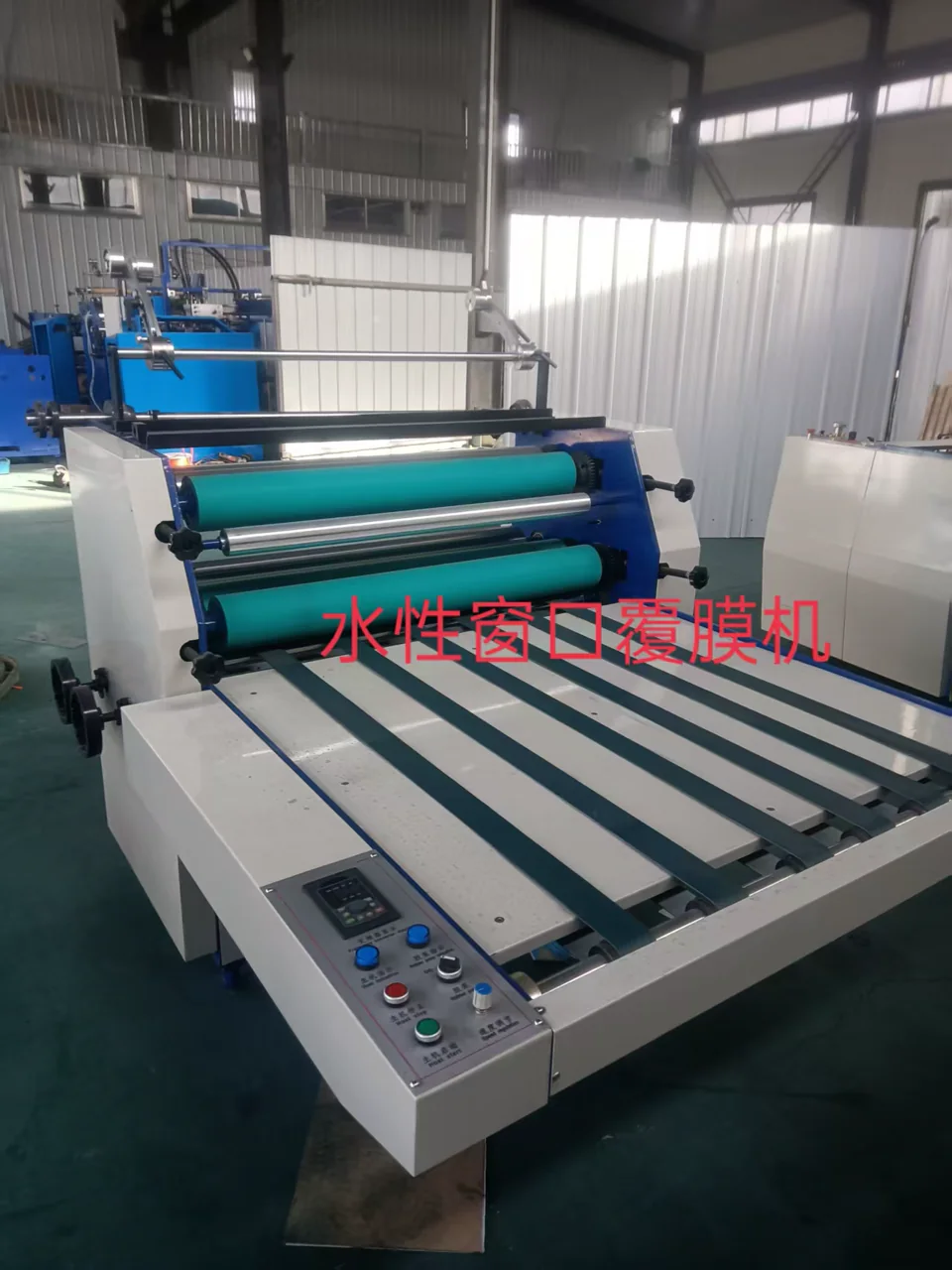 Supplier-provided photo of semi-automatic water-based laminating equipment